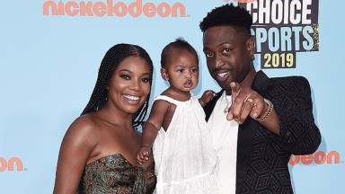 Gabrielle Union & Dwyane Wade with their daughter at the Kids Choice Sports Awards