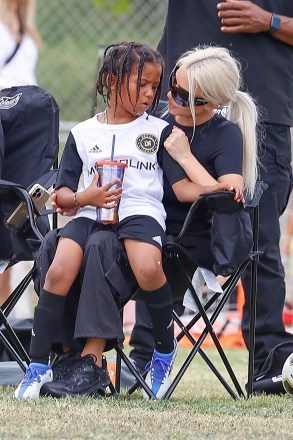 LOS ANGELES - Reality superstar and entrepreneur Kim Kardashian takes a seat in the park while enjoying her son Saint's football game in Los Angeles.  Pictured: Kim Kardashian BACKGRID USA MAY 16, 2022 USA: +1 310 798 9111 / usasales@backgrid.com UK: +44 208 344 2007 / uksales@backgrid.com * UK Clients - Photos featuring Face, Please , Pixe for publication