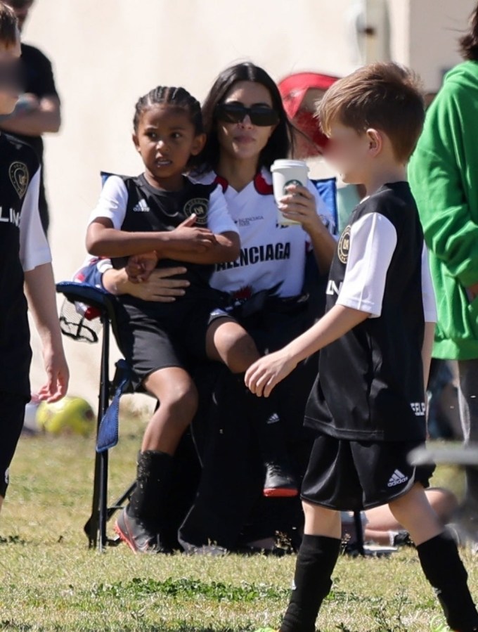 Kim Kardashian Cuddles Saint West At His Soccer Game