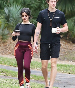 Miami, FL - *EXCLUSIVE* - Quarantine couple Camila Cabello and Shawn Mendes got a dose of Vitamin D with their caffeine in Miami this morning during a walk around their neighborhood. The adorable couple walked hand in hand chatting together as they stepped out for a bit of healthy exercise. Camila who recently announced that she would be postponing her tour dressed up her leggings and crop top with a large pair of hoops while Shawn sported black shorts, a ripped t-shirt, slides and a set of Buddhist prayer beads around his neck.Pictured: Camila Cabello, Shawn MendesBACKGRID USA 26 MARCH 2020 BYLINE MUST READ: MiamiPIXX / BACKGRIDUSA: +1 310 798 9111 / usasales@backgrid.comUK: +44 208 344 2007 / uksales@backgrid.com*UK Clients - Pictures Containing ChildrenPlease Pixelate Face Prior To Publication*