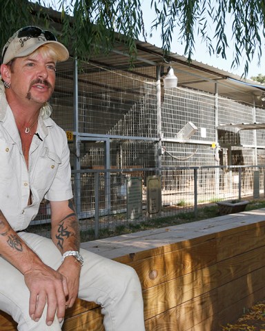 FILE - In this Aug. 28, 2013, file photo, Joseph Maldonado answers a question during an interview at the zoo he runs in Wynnewood, Okla. Authorities continue to investigate the shooting death of Maldonado's husband. Maldonado said his husband accidentally shot himself Friday, Oct. 6, 2017, at The Greater Wynnewood Exotic Animal Park. (AP Photo/Sue Ogrocki, File)