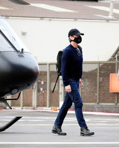 London, UNITED KINGDOM  - *EXCLUSIVE*  - Tom Cruise dons his face mask which is now compulsory in the UK to avoid the ongoing threat of Coronavirus and took to the skies traveling in his impressive looking matte black helicopter out in London.

Pictured: Tom Cruise 

BACKGRID USA 23 JULY 2020 

USA: +1 310 798 9111 / usasales@backgrid.com

UK: +44 208 344 2007 / uksales@backgrid.com

*UK Clients - Pictures Containing Children
Please Pixelate Face Prior To Publication* *CLIENT RESTRICTION APPLIED*