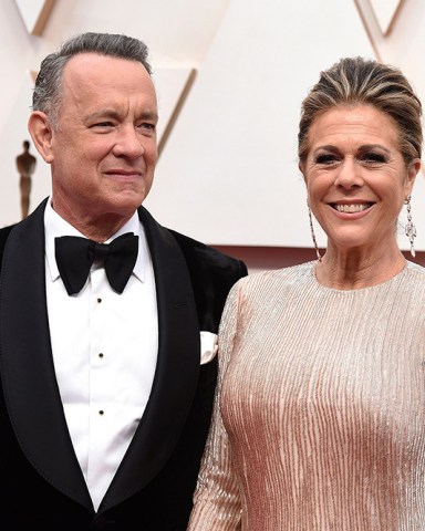 Tom Hanks, left, and Rita Wilson arrive at the Oscars at the Dolby Theatre in Los Angeles. The couple have tested positive for the coronavirus, the actor said in a statement Wednesday, March 11. The 63-year-old actor said they will be "tested, observed and isolated for as long as public health and safety requires
Virus Outbreak Tom Hanks, Los Angeles, United States - 09 Feb 2020