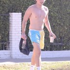*EXCLUSIVE* A shirtless Charlie Puth shows off his guns while heading out of a private gym