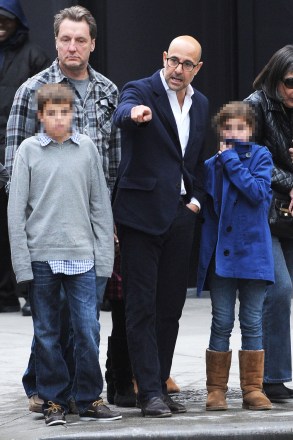 Stanley Tucci out for walk with his children in Manhattan. Tucci pointed to street construction at the intersection of 57th Street and 8th Avenue.Pictured: Stanley Tucci,Nicolo Tucci,Isabel Tucci,Stanley TucciNicolo TucciIsabel TucciRef: SPL452387 271012 NON-EXCLUSIVEPicture by: SplashNews.comSplash News and PicturesUSA: +1 310-525-5808London: +44 (0)20 8126 1009Berlin: +49 175 3764 166photodesk@splashnews.comWorld Rights