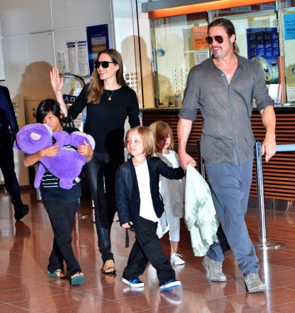 Angelina Jolie and Brad Pitt with children Pax Jolie-Pitt, Knox Jolie-Pitt, Vivienne Jolie-Pitt Brad Pitt, Angelina Jolie and family arrive at Haneda International Airport in Japan - July 28, 2013