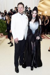 Elon Musk, Grimes. Elon Musk, left and Grimes attends The Metropolitan Museum of Art's Costume Institute benefit gala celebrating the opening of the Heavenly Bodies: Fashion and the Catholic Imagination exhibition, in New York2018 MET Museum Costume Institute Benefit Gala, New York, USA - 07 May 2018