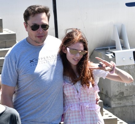 SpaceX CEO ELON MUSK with his new girlfriend, UK singer singer GRIMES, as the last of 4 teams of students comprised of over 600 competitors from more than 40 countries around the world compete to showcase their pods at SpaceX's third Hyperloop Pod Competition Sunday.  The winning team was WARR Hyperloop, as they hit speeds of 284 mph today.  Jul 22, 2018 Pictured: Elon Musk, Grimes.  Photo credit: ZUMAPRESS.com / MEGA TheMegaAgency.com +1 888 505 6342 (Mega Agency TagID: MEGA256116_001.jpg) [Photo via Mega Agency]