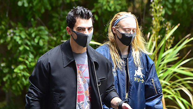 Joe Jonas & Sophie Turner walking their dog