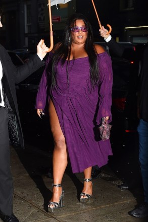 New York, NY  - Lizzo rocks a purple dress with matching sunglasses as she arrives at Anna Wintour's pre-Met gala dinner party.Pictured: LizzoBACKGRID USA 30 APRIL 2023 USA: +1 310 798 9111 / usasales@backgrid.comUK: +44 208 344 2007 / uksales@backgrid.com*UK Clients - Pictures Containing ChildrenPlease Pixelate Face Prior To Publication*