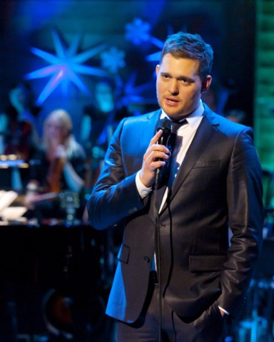 Editorial use onlyMandatory Credit: Photo by ITV/Shutterstock (1536483m)Michael Buble'Michael Buble - Home for Christmas' TV Programme - Dec 2011The Grammy award winning singer songwriter will be sprinkling his unique blend of extraordinary talent and infectious humour in this one off Christmas Special.  Headlining this exciting new show, Michael will be unwrapping a host of celebrity guests including X Factor judge Gary Barlow and comedienne Dawn French who will be joining the show's festivities, which will see some unmissable duets, including an exclusive performance with The X Factor's Kelly Rowland.  Michael and Kelly will join forces for the first time to sing one of the country's best loved Christmas hits.        Following the success of his previous ITV shows, An Audience With and This Is Michael Bublé, the critically acclaimed performer will be recreating his own Canadian luxurious winter retreat here in the UK.  Having sold an estimated 30 million albums, the singer will be performing classic seasonal hits from his new album 'Christmas' as well other favourites.   Other guests include Naturally 7, The Puppini Sisters and Gino D'Acampo