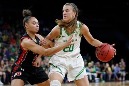 Oregon's Sabrina Ionescu (20) drives into Oregon's Satou Sabally (0) during the second half of an NCAA college basketball game in the quarterfinal round of the Pac-12 women's tournament, in Las Vegas
P12 Oregon Utah Basketball, Las Vegas, USA - 06 Mar 2020