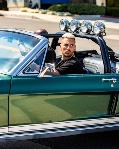 Calabasas, CA  - *EXCLUSIVE*  - Scott Disick appears to have purchased a Mustang from Richard Rawlins of Gas Monkey Garage. Scott drove the mustang to Mullholland Harley Davidson where he was seen vaping and looking to purchase a motorcycle. Scott was also sporting a mohawk/mullet hairdoo and appears to be trying his best to rock out his image to keep up with Travis Barker and win back Kourtney Kardashian's attention. Scott was also seen wearing a vape around his neck and hitting it while he was talking to the manager of the shop. Scott has completely dumped his preppy boy image and is now going hard core towards MGK and Travis Barker's rocker image.Pictured: Scott DisickBACKGRID USA 17 MAY 2021 BYLINE MUST READ: IXOLA / BACKGRIDUSA: +1 310 798 9111 / usasales@backgrid.comUK: +44 208 344 2007 / uksales@backgrid.com*UK Clients - Pictures Containing ChildrenPlease Pixelate Face Prior To Publication*