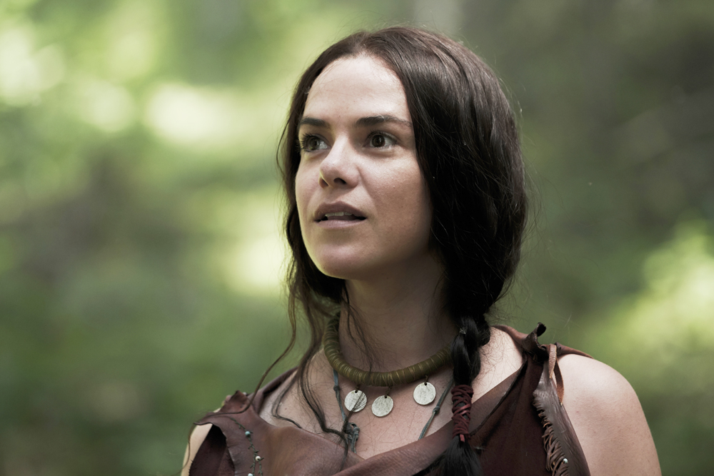 Mari (Kaniehtiio Horn) watches Sel as they pause in the woods. (National Geographic/Peter H. Stranks)