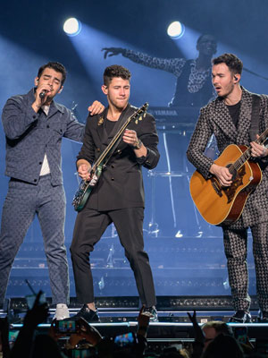 Jonas Brothers performing on stage