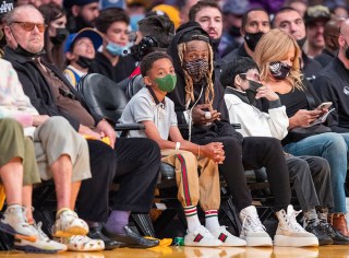 Actor Jack Nicholson, left, and rapper Lil Wayne and his son Kameron Carter attend a game between the Golden State Warriors and the Los Angeles Lakers on October 19, 2021 at Staples Center in Los Angeles.
Celebrities attend Los Angeles Lakers v Golden State Warriors, Staples Center, Los Angeles, California, USA - 19 Oct 2021