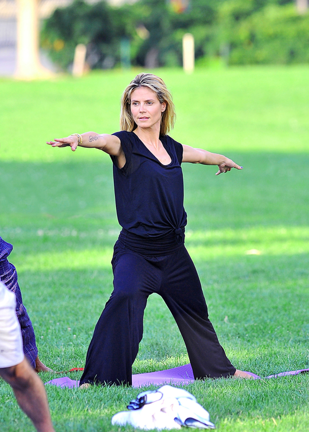 Heidi Klum keeps in shape by doing yoga with friend Russell Simmons in NYC