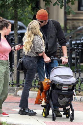 Boston, MA - *EXCLUSIVE* - Emma Roberts and Garrett Hedlund spotted kissing while out for a stroll in Boston with baby Rhodes.  Their day included a visit to the Boston Public Library, sharing parenting duties by carrying Rhode's stroller down the stairs.  Pictured: Emma Roberts, Garrett Hedlund BACKGRID USA 25 JUNE 2021 BYLINE MUST READ: Patriot Pics / BACKGRID USA: +1 310 798 9111 / usasales@backgrid.com UK: +44 208 344 2007 / uksales@backgrid.com *UK Clients - Pictures Containing Children Please Pixelate Face Prior To Publication*