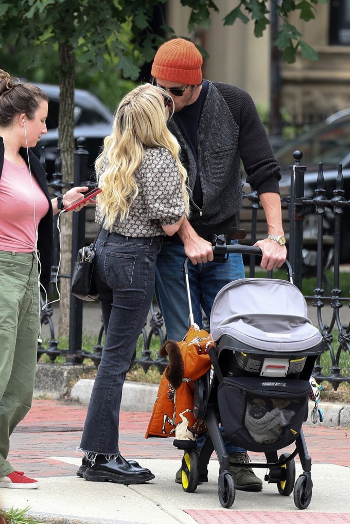 Emma Roberts and Garrett Hedlund kiss while out in Boston with baby Rhodes