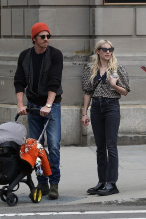 Boston, MA - *EXCLUSIVE* - Emma Roberts and Garrett Hedlund spotted kissing while out for a stroll in Boston with baby Rhodes.  Their day included a visit to the Boston Public Library, sharing parenting duties by carrying Rhode's stroller down the stairs. Pictured: Emma Roberts, Garrett HedlundBACKGRID USA 25 JUNE 2021 BYLINE MUST READ: Patriot Pics / BACKGRIDUSA: +1 310 798 9111 / usasales@ backgrid.comUK: +44 208 344 2007 / uksales@backgrid.com*UK Clients - Pictures Containing ChildrenPlease Pixelate Face Prior To Publication*