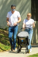 Hollywood, CA - *EXCLUSIVE* - Emma Roberts and partner Garrett Hedlund step out for some fresh air wearing matching white tees and blue jeans. The new parents walked to a local coffee shop near their Hollywood home and brought along their newborn son Rhodes.Pictured: Emma Roberts, Garrett HedlundBACKGRID USA 28 MARCH 2021 USA: +1 310 798 9111 / usasales@backgrid.comUK: +44 208 344 2007 / uksales@backgrid.com*UK Clients - Pictures Containing ChildrenPlease Pixelate Face Prior To Publication*