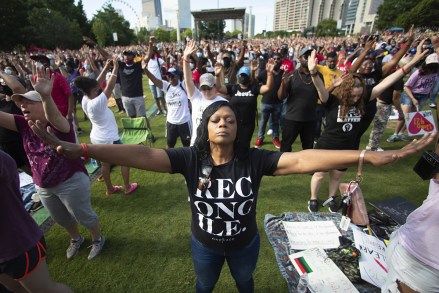 Woman prays during a OneRace March on Atlanta prayer service and march in response to recent racially violence, in Atlanta
Juneteenth , Atlanta, United States - 19 Jun 2020