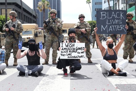 Los Angeles, CA  - *EXCLUSIVE*  - Singer Madison Beer crouches down on the front lines of today's Black Lives Matter protest and peacefully protest with the National Guard behind her.Pictured: Madison BeerBACKGRID USA 2 JUNE 2020 BYLINE MUST READ: 3 / BACKGRIDUSA: +1 310 798 9111 / usasales@backgrid.comUK: +44 208 344 2007 / uksales@backgrid.com*UK Clients - Pictures Containing ChildrenPlease Pixelate Face Prior To Publication*