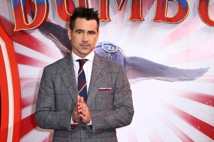 Actor Colin Farrell waits for photographers as he arrives at a screening of the film 'Dumbo' in London, Thursday, March 21, 2019. (Photo by Joel C Ryan/Invision/AP)
