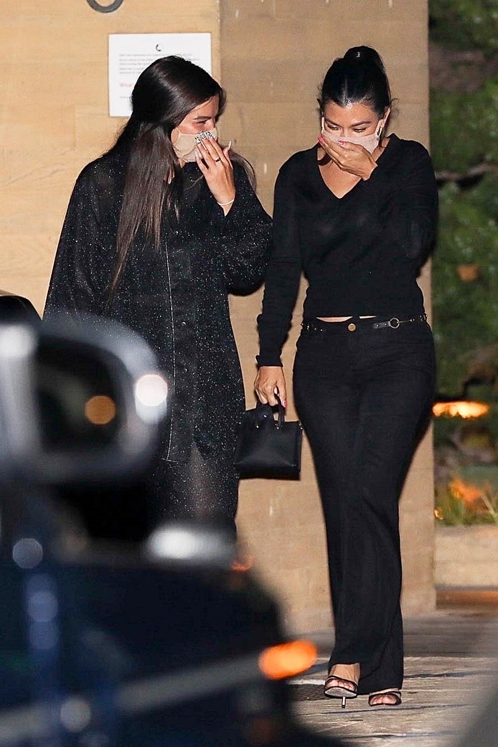 Kourtney Kardashian and Addison Rae can't contain the giggles while leaving dinner at Nobu