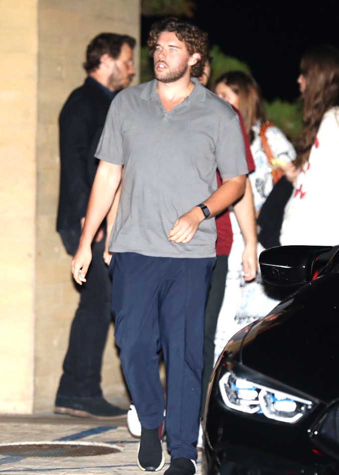 Christopher walks during a family outing