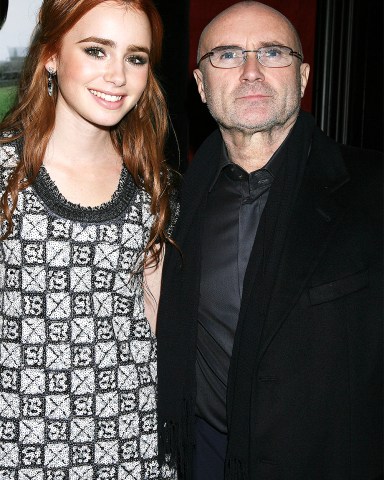 Phil Collins and Lily Collins (daughter)
'The Blind Side' Film Premiere, New York, America - 17 Nov 2009
Based on the book by Michael Lewis, this film follows the story of American footballer Michael Oher (played by Quinton Aaron), who currently plays for the NFL’s Baltimore Ravens. It follows his impoverished upbringings, his years at a Christian School and his adoption by Sean and Leigh Anne Tuohy, the couple played in the film by Tim McGraw and Sandra Bullock. Lily Collins (daughter of rocker Phil) plays the Tuohys’ daughter, aptly enough called Collins.