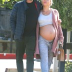 *EXCLUSIVE* Brian Austin Green and Sharna Burgess are head over heels over their pregnancy! Couple shares sweet PDA moment out in Malibu!