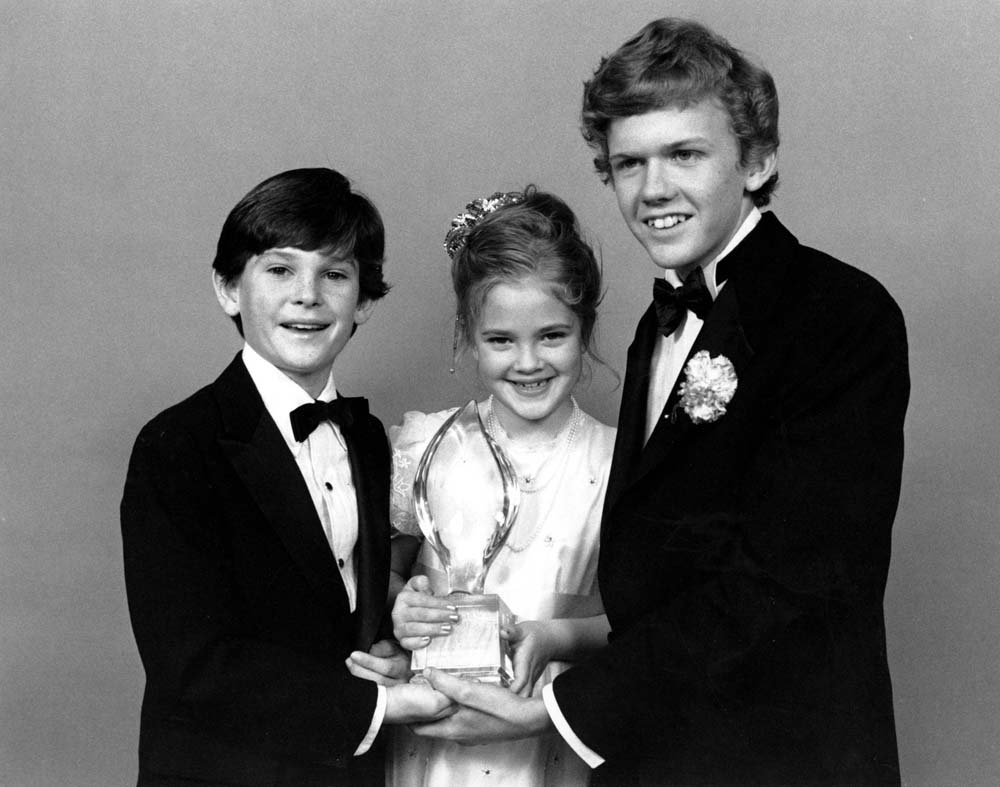 Drew Barrymore, center, Henry Thomas, left, and Robert Macnaughton, the young stars of Steven Spielberg's film 