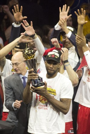 The Toronto Raptors celebrates with the Larry O'Brien Championship Trophy after his team defeated the Golden State Warriors to win Game Six of the 2019 NBA Finals at ORACLE Arena on June 13, 2019 in Oakland, California..Armando Arorizo. 13 Jun 2019 Pictured: OAKLAND, CALIFORNIA - JUNE 13: Kawhi Leonard #2 of the Toronto Raptors hold the Bill Russell MVP Award as he celebrates with his teams win over the Golden State Warriors in Game Six to win the 2019 NBA Finals at ORACLE Arena on June 13, 2019 in Oakland, California.Armando Arorizo. Photo credit: ZUMAPRESS.com / MEGA TheMegaAgency.com +1 888 505 6342 (Mega Agency TagID: MEGA444162_031.jpg) [Photo via Mega Agency]