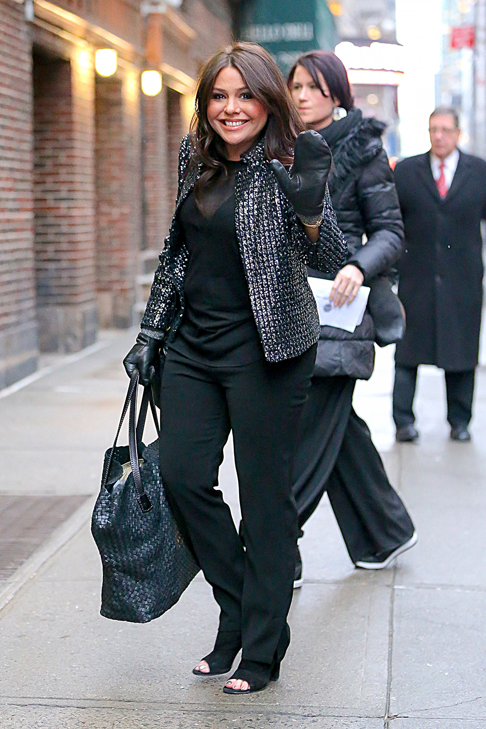 Rachael Ray waves while arriving at The Late Show with Stephen Colbert in New York City