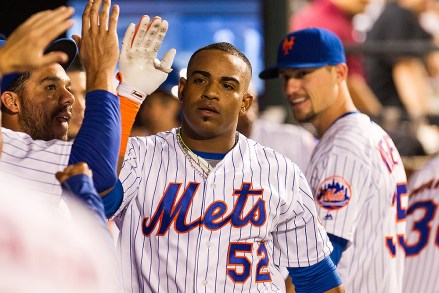 July 27, 2016: New York Mets center fielder Yoenis Céspedes (52) gets congratulated n the dugout after a two run home run during a regular season National League match-up between the St. Louis Cardinals and the New York Mets at Citi Field in Flushing, NY. (Photo by David Hahn/Icon Sportswire) (Icon Sportswire via AP Images)