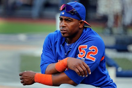 FILE - In this July 20, 2018, file photo, New York Mets' Yoenis Cespedes stretches before a baseball game against the New York Yankees in New York. When baseball comes back next month, Cespedes might finally be ready to return, too. Sidelined for nearly two years by injuries and then the coronavirus pandemic, the Mets slugger could be healthy enough at last to play on opening day in late July — especially with the designated hitter available in the National League this season. General manager Brodie Van Wagenen said Monday, June 29, 2020, the team is optimistic about Céspedes. (AP Photo/Julie Jacobson, File)