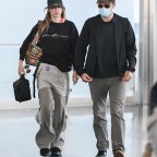 *EXCLUSIVE* Robert Pattinson and Suki Waterhouse touch down at JFK airport wearing matching outfits