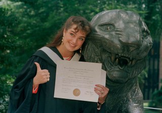 Actress Brooke Shields gives the thumbs-up in her cap and gown as she shows her diploma during graduation ceremonies at Princeton University in Princeton, N.J., June 9, 1987. (AP Photo/Jack Kanthal)