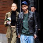 Gigi Hadid and Zayn Malik hold hands as they head out from her apartment