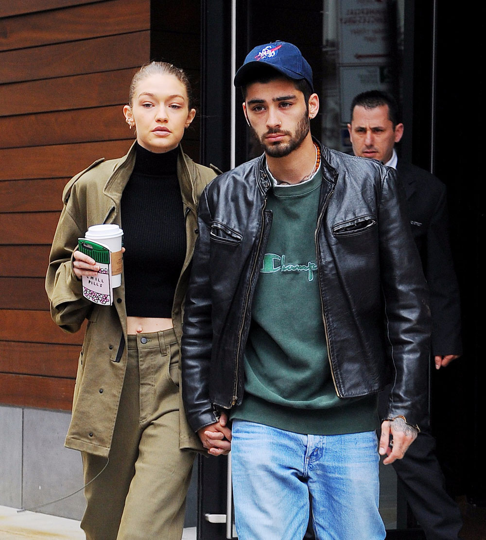 Gigi Hadid and Zayn Malik hold hands as they head out from her apartment