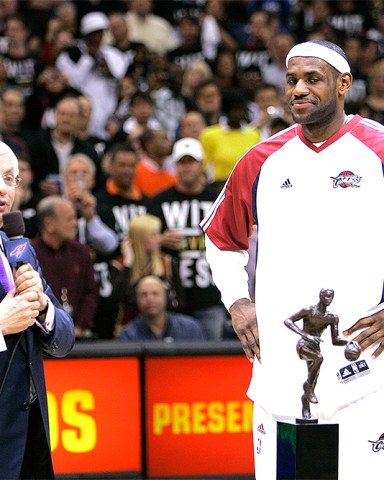 NBA Commissioner David Stern, left, presents Cleveland Cavaliers' LeBron James with the 2008-2009 MVP trophy before an Eastern Conference semifinal basketball game against the Atlanta Hawks Tuesday, May 5, 2009, in Cleveland. (AP Photo/Mark Duncan)