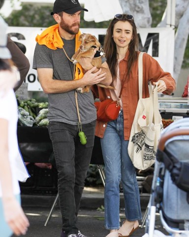 Los Angeles, CA  - *EXCLUSIVE*  - Look out Charlie, Lily Collins has a new man in her life! Ok, maybe not quite - looks like Lily Collins has a brand new puppy and she was happy to show him off while shopping at the Farmers Market with boyfriend Charlie McDowell.Pictured: Lily Collins, Charlie McDowellBACKGRID USA 2 FEBRUARY 2020 BYLINE MUST READ: LESE / BACKGRIDUSA: +1 310 798 9111 / usasales@backgrid.comUK: +44 208 344 2007 / uksales@backgrid.com*UK Clients - Pictures Containing ChildrenPlease Pixelate Face Prior To Publication*