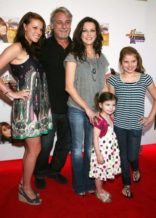 John McBride, wife Martina McBride and their three children.
'Hannah Montana: the Movie' film screening at Regal Cinemas, Nashville, America - 09 Apr 2009
The film is the popular Disney character's first foray onto the big screen and takes teen sensation Miley's 'Hannah Montana' series to the next level. It sees Miley Stewart struggling to juggle school, her friends and her secret pop-star persona, Hannah Montana. With fame threatening to consume his daughter, Miley's father Robby Ray (played by Miley's real life dad Billy Ray Cyrus) takes the family back home to Grandma Ruby's (Margo Martindale) Tennessee farm in Crowley Corners. Initially out of her element, Miley soon finds romance and learns a thing or two about what it means to truly live life out of the spotlight.