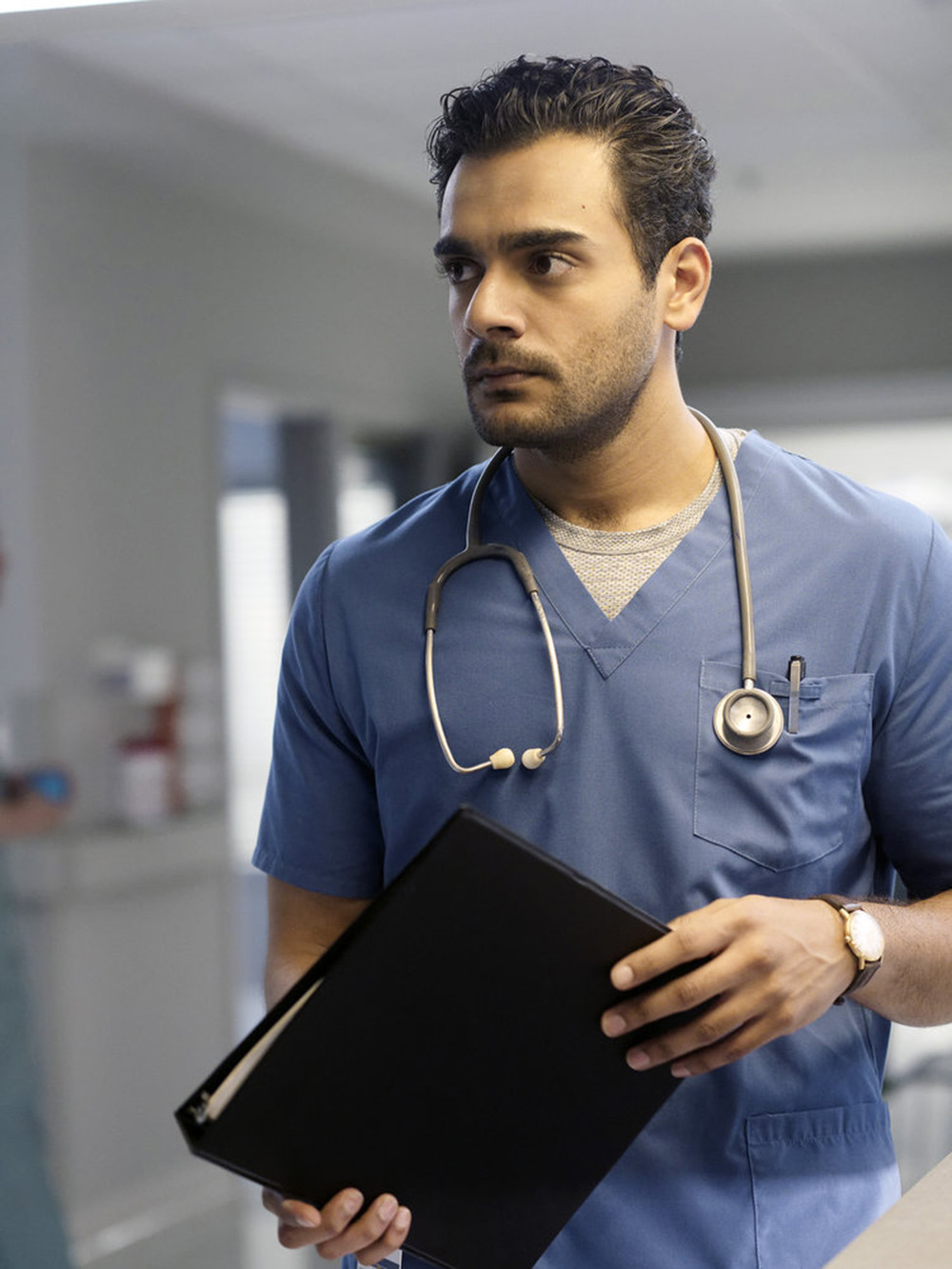 TRANSPLANT -- "Your Secrets Can Kill You" Episode 103 -- Pictured: Hamza Haq as Dr. Bashir "Bash" Hamed -- (Photo by: Yan Turcotte/Sphere Media/CTV/NBC)