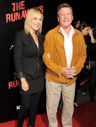 Tatum O'Neal, left, a cast member in "The Runaways," and her father, actor Ryan O'Neal, pose together at the premiere of the film in Los Angeles, Thursday, March 11, 2010. (AP Photo/Chris Pizzello)