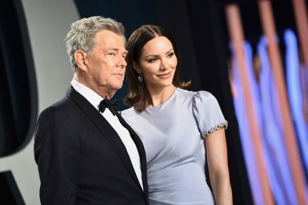 David Foster, left, and Katherine Hope McPhee Foster arrive at the Vanity Fair Oscar Party on Sunday, February 9, 2020 in Beverly Hills, Calif.  (Photo by Ivan Agostini/InVision/AP)