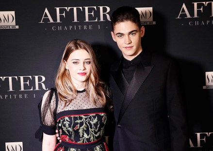 Actress Josephine Langford and actor Hero Fiennes-Tiffin poses before the screening of the film After - Chapter 1, in Paris, Monday, April 1, 2019. (AP Photo/Christophe Ena)