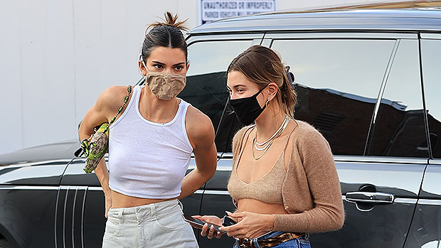Kendall Jenner showcases her slim physique in a tank top for a