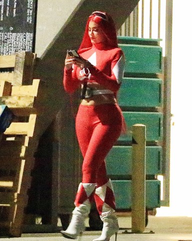 West Hollywood, CA  - *EXCLUSIVE*  - Kylie Jenner shows off her curves in her red power ranger costume with a scarlett red wig as she is spotted sneaking out of a party in West Hollywood. She among her close friends Stassi Karanikolaou, Victoria Villarreal, & Carter Gregory dressed up in Power Rangers costumes and hit the town. They ended up at an exclusive party in West Hollywood, but Kylie decided to sneak out by herself accompanied by her body guard.  Pictured: Kylie Jenner  BACKGRID USA 30 OCTOBER 2020   BYLINE MUST READ: BACKGRID  USA: +1 310 798 9111 / usasales@backgrid.com  UK: +44 208 344 2007 / uksales@backgrid.com  *UK Clients - Pictures Containing Children Please Pixelate Face Prior To Publication*